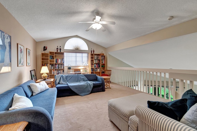 carpeted living room with ceiling fan, a textured ceiling, and lofted ceiling