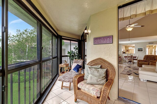 sunroom / solarium with ceiling fan