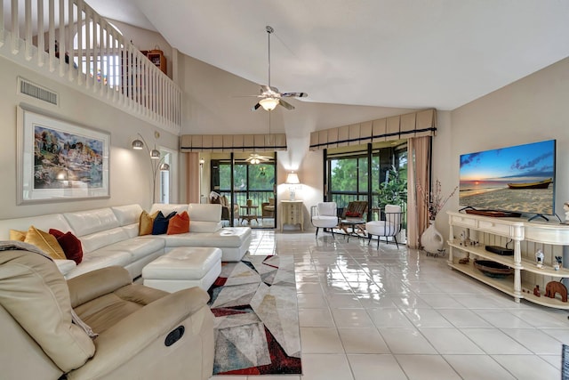 living room with ceiling fan, high vaulted ceiling, and light tile patterned flooring