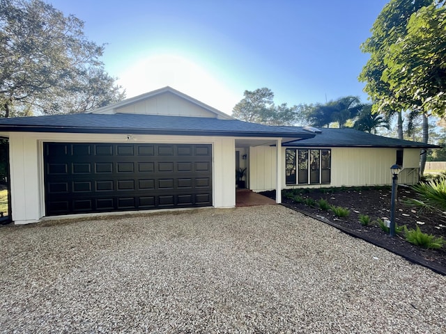 single story home with a garage