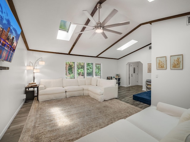 living room with dark hardwood / wood-style floors, ceiling fan, and high vaulted ceiling