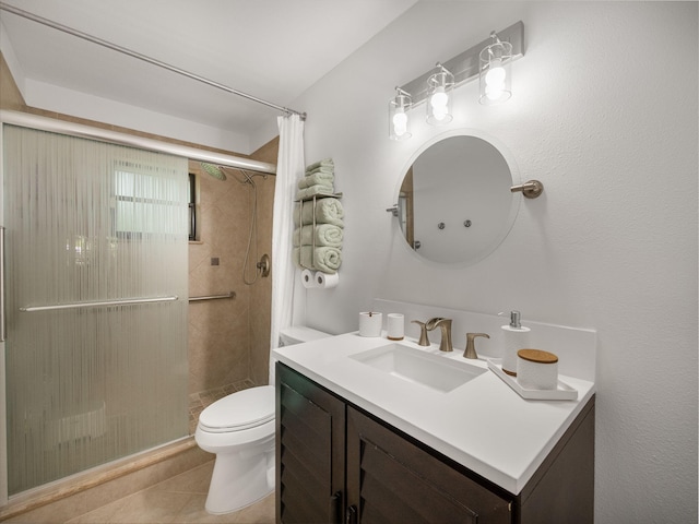 bathroom featuring tile patterned flooring, a shower with curtain, toilet, and vanity