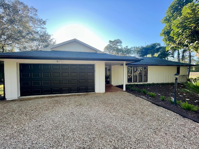 ranch-style home featuring a garage