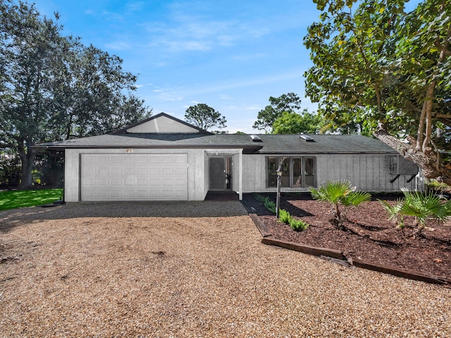 ranch-style home featuring a garage