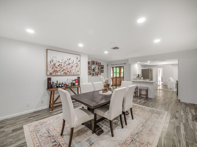 dining space featuring light hardwood / wood-style flooring