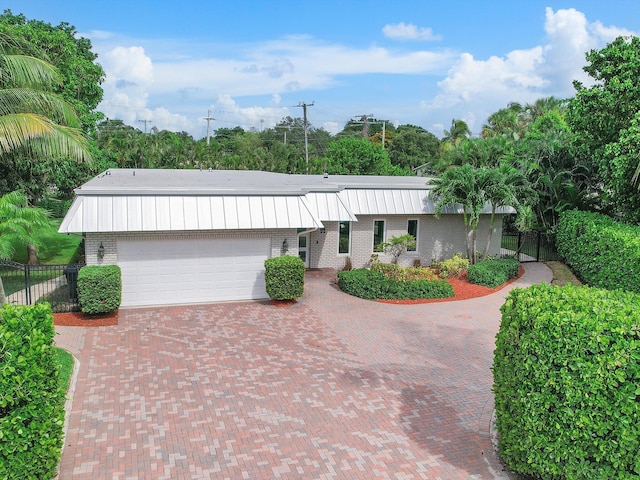 ranch-style home featuring a garage