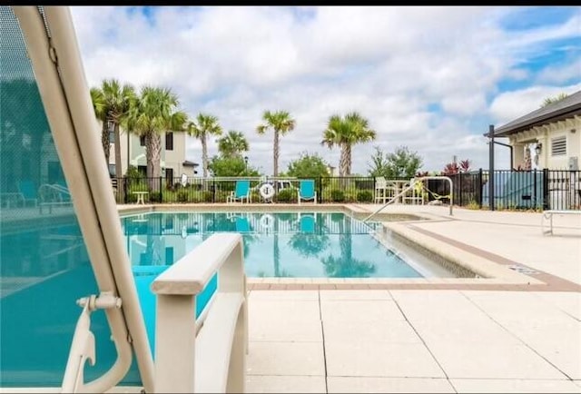 view of swimming pool featuring a patio area