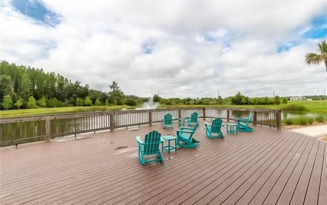 wooden deck featuring a water view