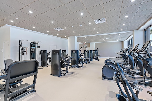 exercise room featuring a drop ceiling