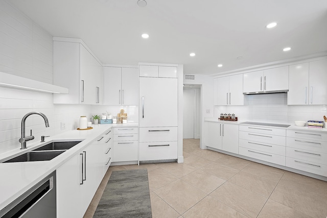 kitchen featuring sink, white cabinets, backsplash, stainless steel dishwasher, and black electric cooktop