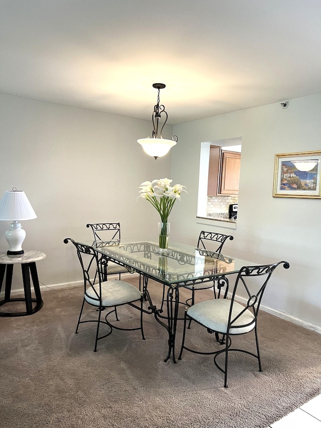 dining room featuring carpet