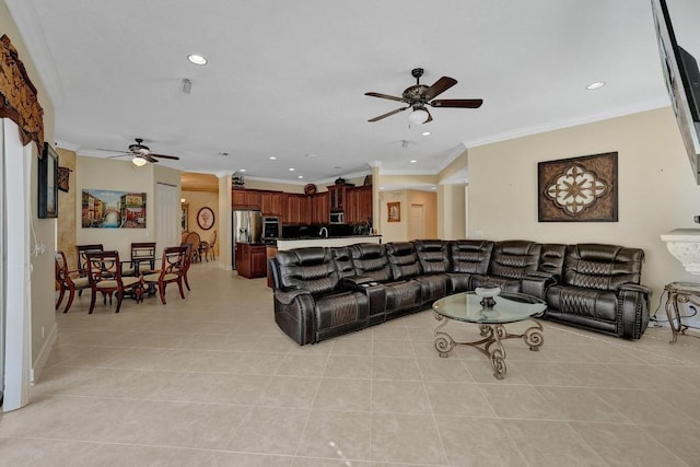 tiled living room with ceiling fan and ornamental molding