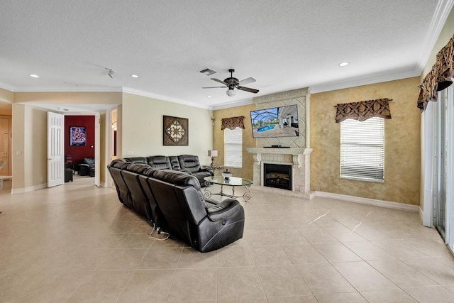 living room with light tile patterned floors, a textured ceiling, and a tile fireplace