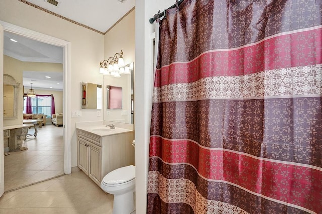 bathroom featuring crown molding, tile patterned floors, vanity, and toilet