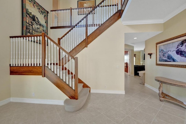 stairway featuring ornamental molding and tile patterned flooring