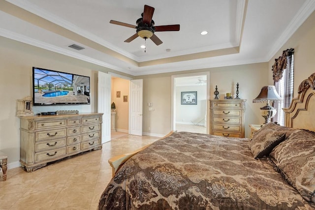 bedroom with a raised ceiling, light tile patterned floors, ceiling fan, and ornamental molding