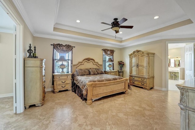 tiled bedroom featuring connected bathroom, a tray ceiling, ornamental molding, and ceiling fan