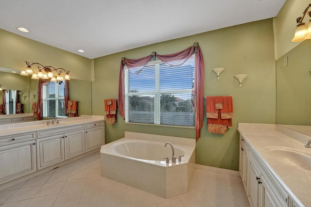 bathroom featuring vanity, tile patterned flooring, and a bathing tub