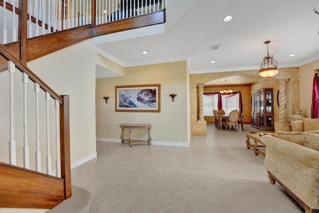 tiled living room featuring crown molding and an inviting chandelier