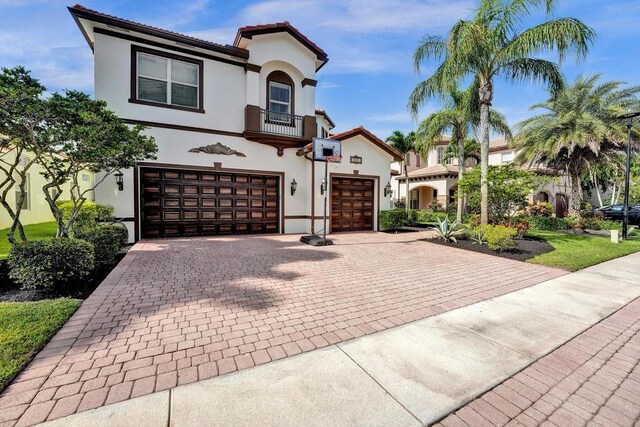 mediterranean / spanish-style house featuring a garage