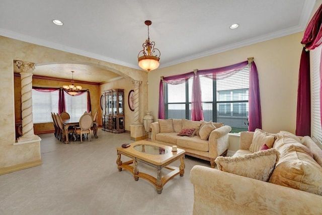 tiled living room featuring ornamental molding and an inviting chandelier