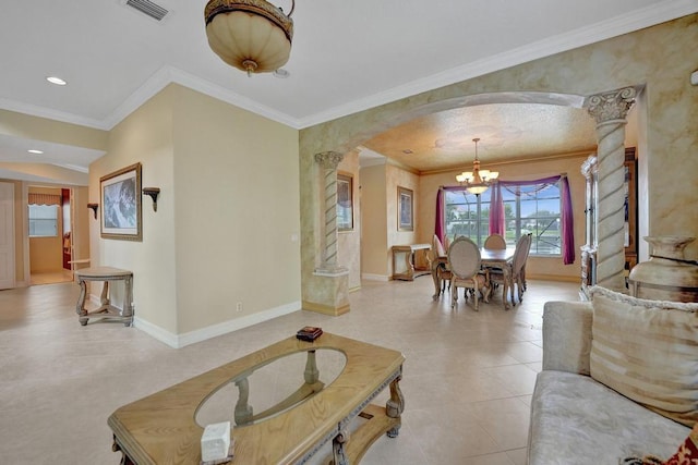 tiled living room with ornamental molding and a chandelier