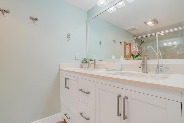 bathroom with vanity and walk in shower