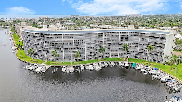 birds eye view of property with a water view