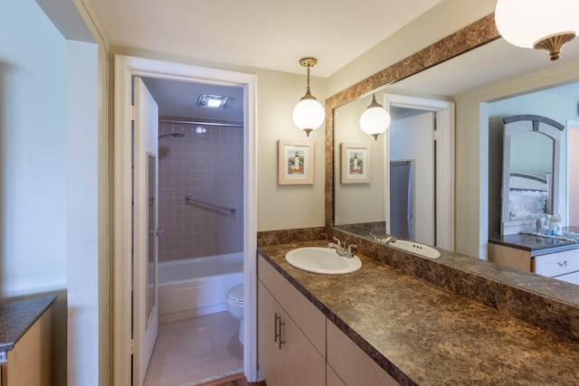 full bathroom with tiled shower / bath, vanity, toilet, and tile patterned flooring