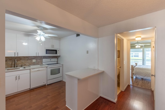 kitchen featuring white cabinets, sink, white appliances, and ceiling fan