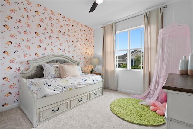 bedroom with ceiling fan and light colored carpet