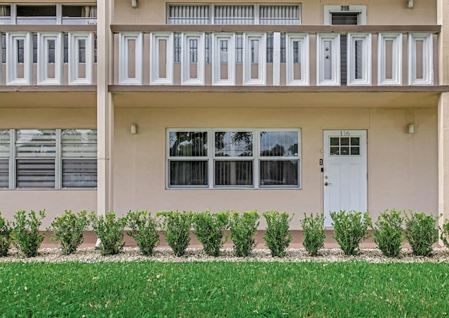 entrance to property with a balcony