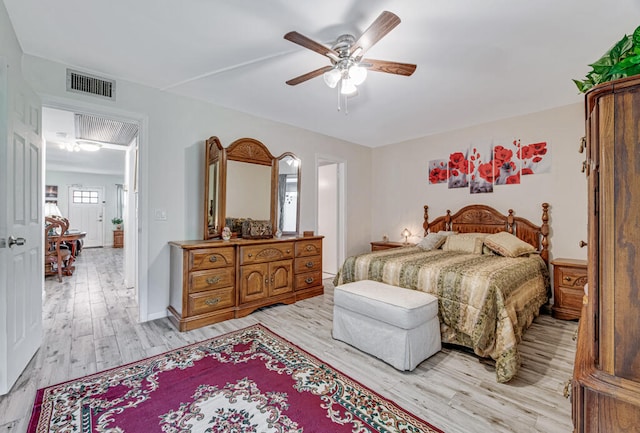 bedroom featuring ceiling fan and light hardwood / wood-style floors