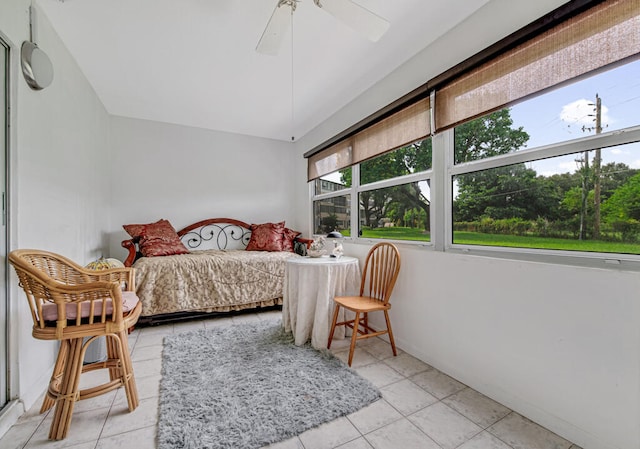 bedroom with ceiling fan and light tile patterned floors