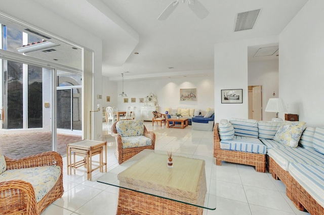 living room with light tile patterned floors and ceiling fan