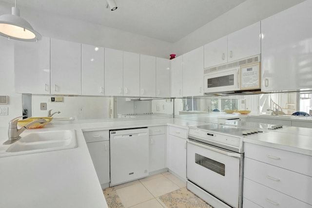 kitchen featuring sink, hanging light fixtures, white cabinets, white appliances, and light tile patterned flooring