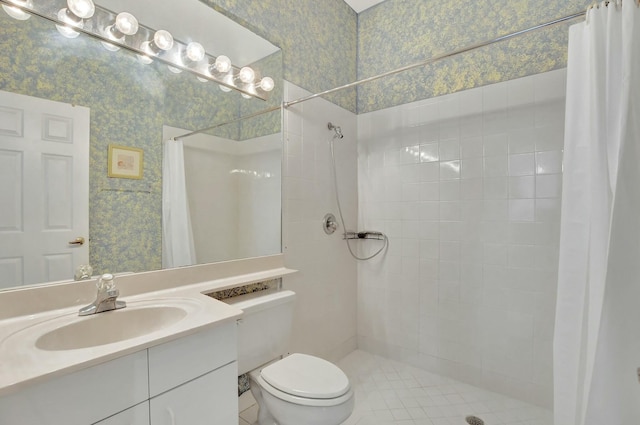 bathroom with toilet, a shower with curtain, vanity, and tile patterned floors