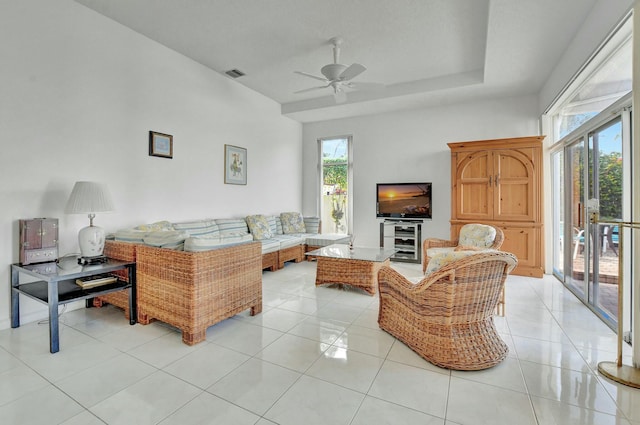 tiled living room featuring ceiling fan