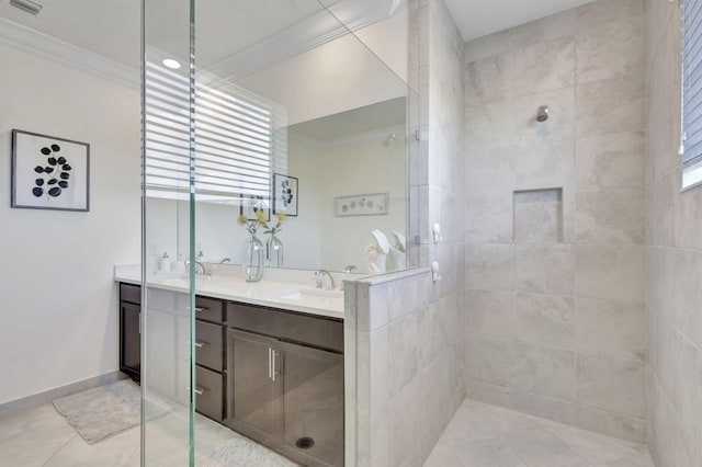 bathroom with tile patterned flooring, an enclosed shower, crown molding, and vanity