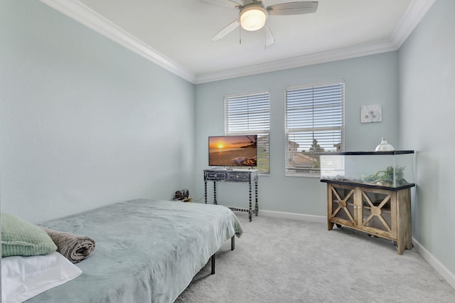 carpeted bedroom with ceiling fan and crown molding