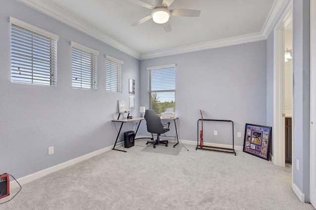 office area featuring ceiling fan, crown molding, and light colored carpet