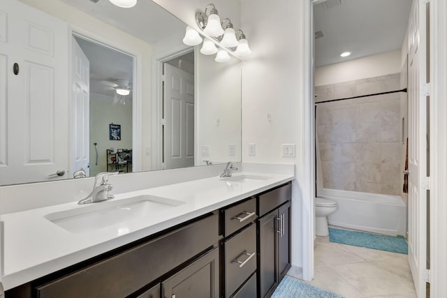 full bathroom featuring ceiling fan, dual vanity, toilet, tile patterned floors, and shower / bath combination with curtain