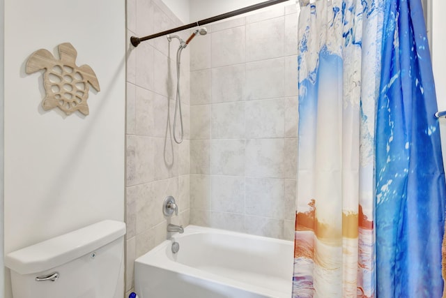 bathroom featuring toilet and shower / tub combo with curtain