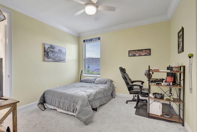 bedroom with carpet floors, ornamental molding, and ceiling fan