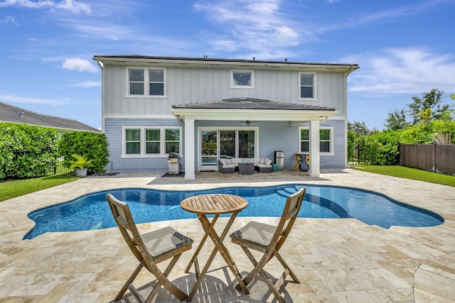 view of pool featuring ceiling fan, a grill, a patio area, and an outdoor hangout area