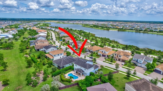 birds eye view of property featuring a water view