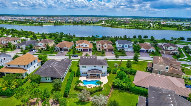 birds eye view of property featuring a water view