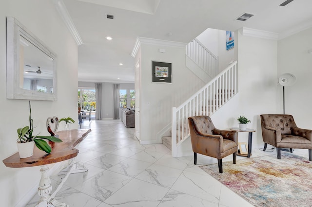 foyer with ceiling fan, light tile patterned floors, and ornamental molding