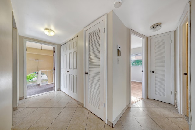 corridor with light tile patterned floors