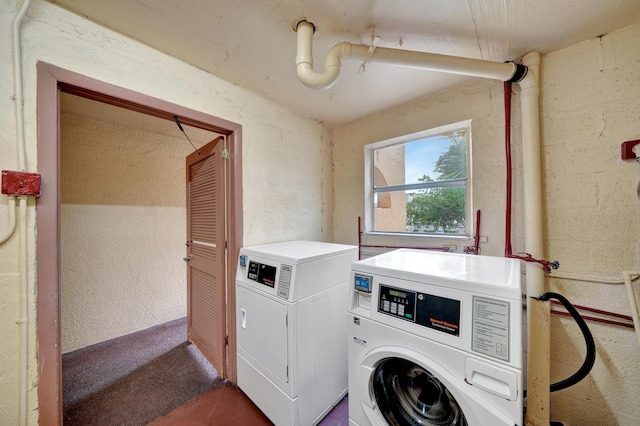 washroom featuring washing machine and dryer